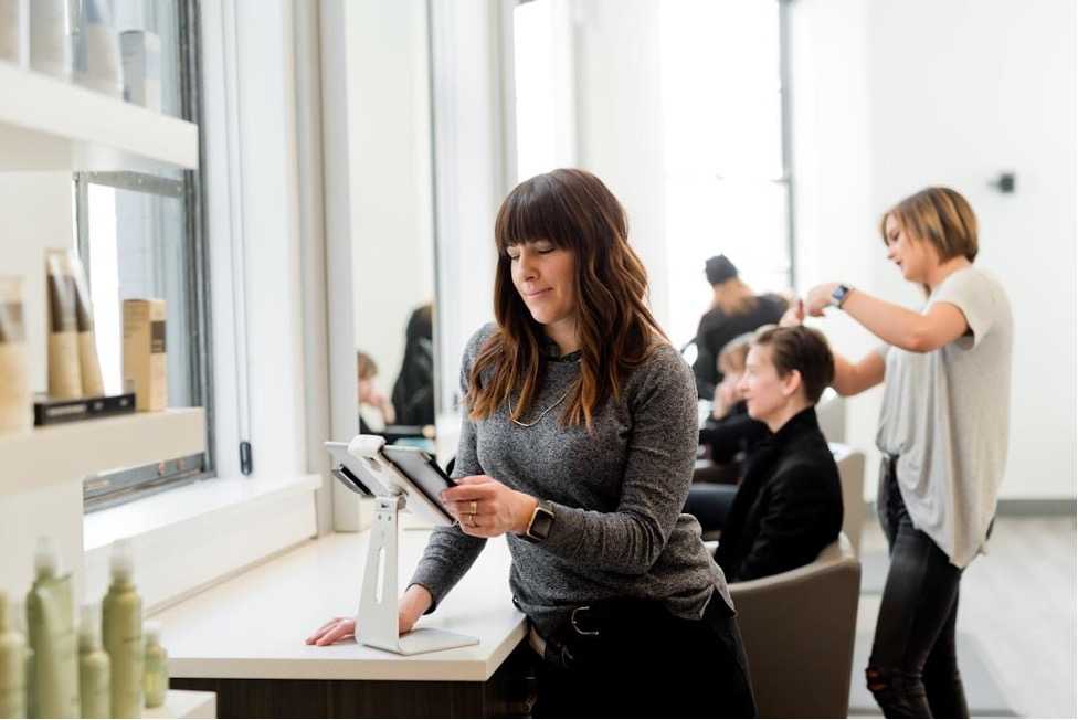 A business owner utilizing online fax services to enhance cost-effectiveness and improve workflow efficiency, eliminating the need for costly equipment and reducing operational expenses