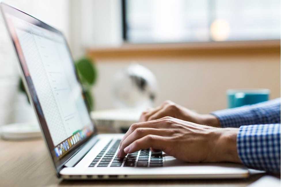 An individual using an online fax service with enhanced security features to protect sensitive information